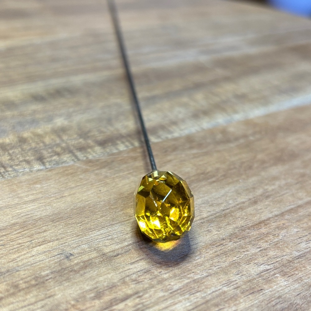 Yellow faceted glass hat pin